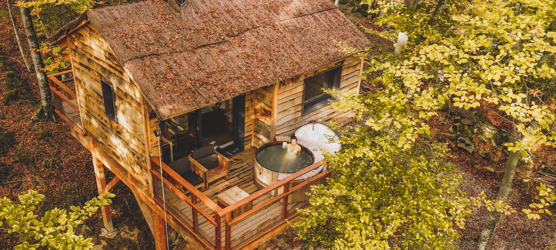 Tourist relaxing in a jacuzzi at a cabin in the Vall de Bianya in Girona, Catalonia