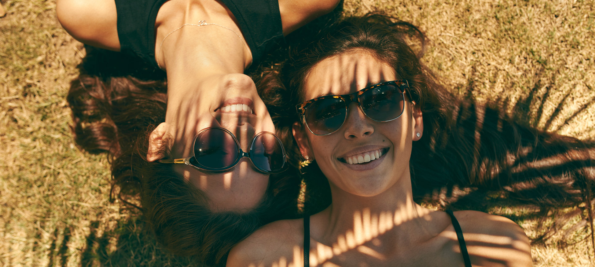 A group of happy girls sunbathing A group of happy girls sunbathing