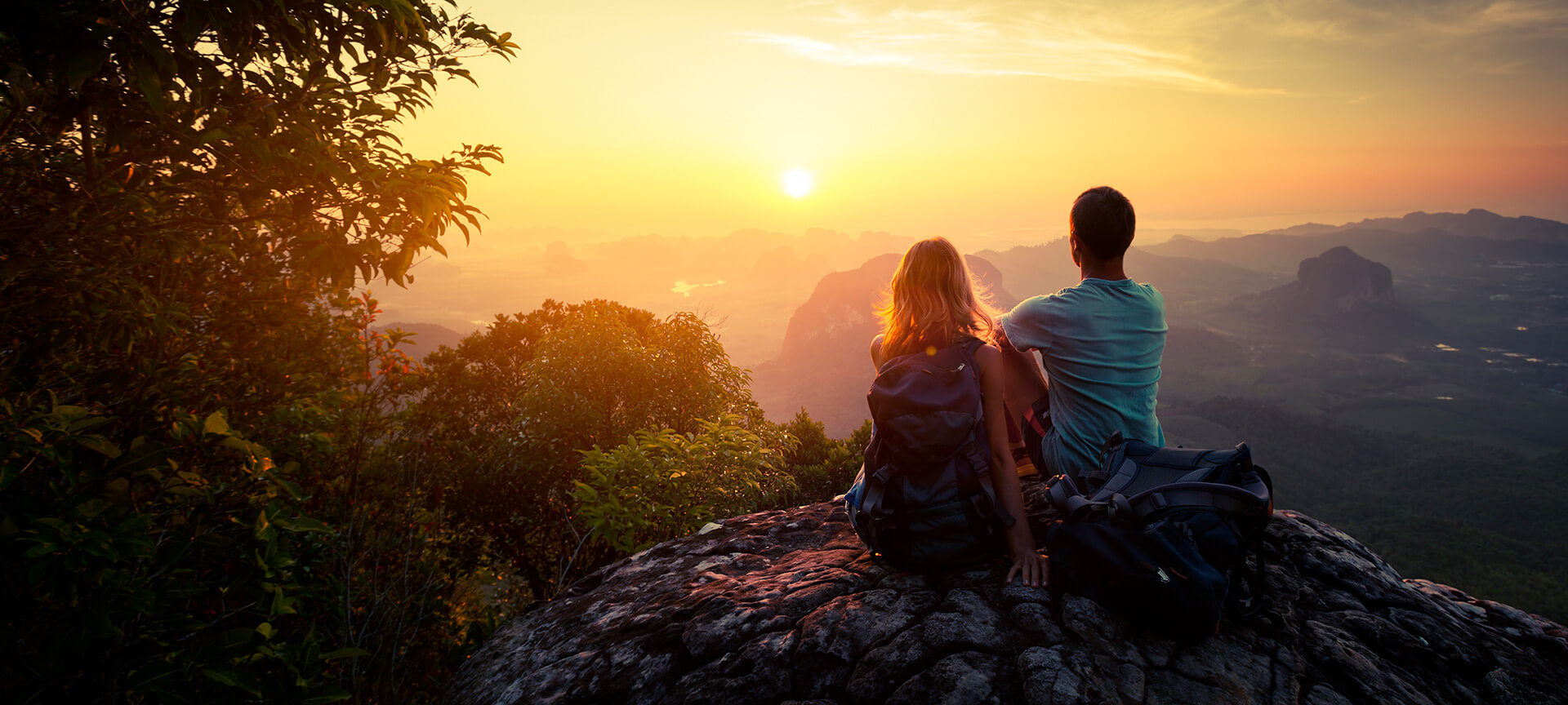 Couple watching the sunset in a natural setting
