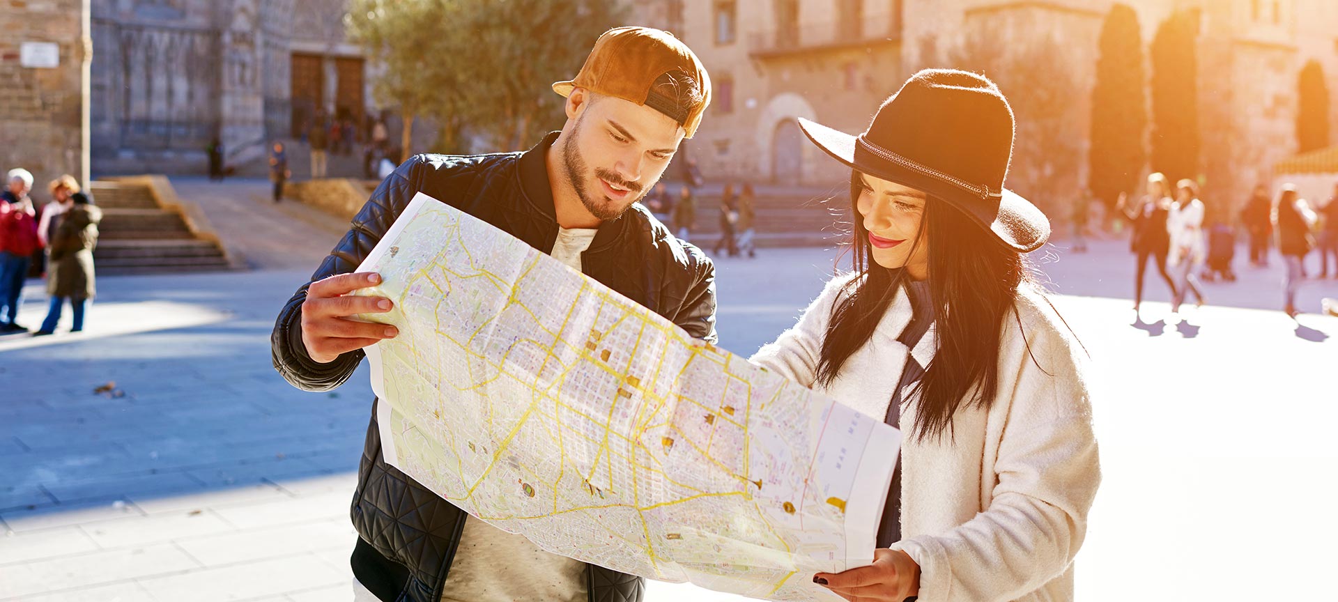 Young couple looking at a map in Barcelona Young couple looking at a map in Barcelona