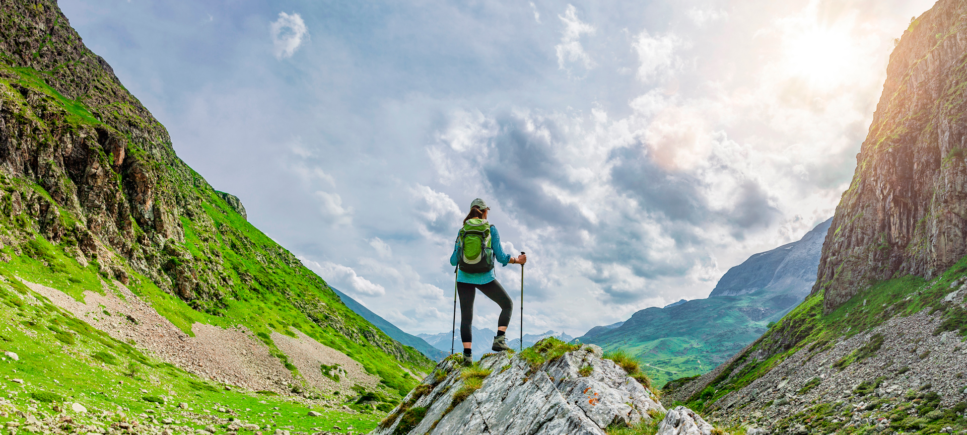 Hiker admiring the views on a route through the Pyrenees Hiker admiring the views on a route through the Pyrenees