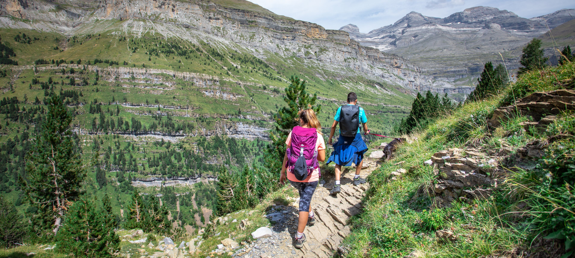 Hikers walking through the Ordesa y Monte Perdido National Park in Aragon Hikers walking through the Ordesa y Monte Perdido National Park in Aragon