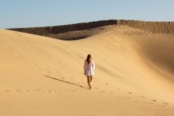 Tourist in the Maspalomas Dunes Special Nature Reserve in Gran Canaria, Canary Islands