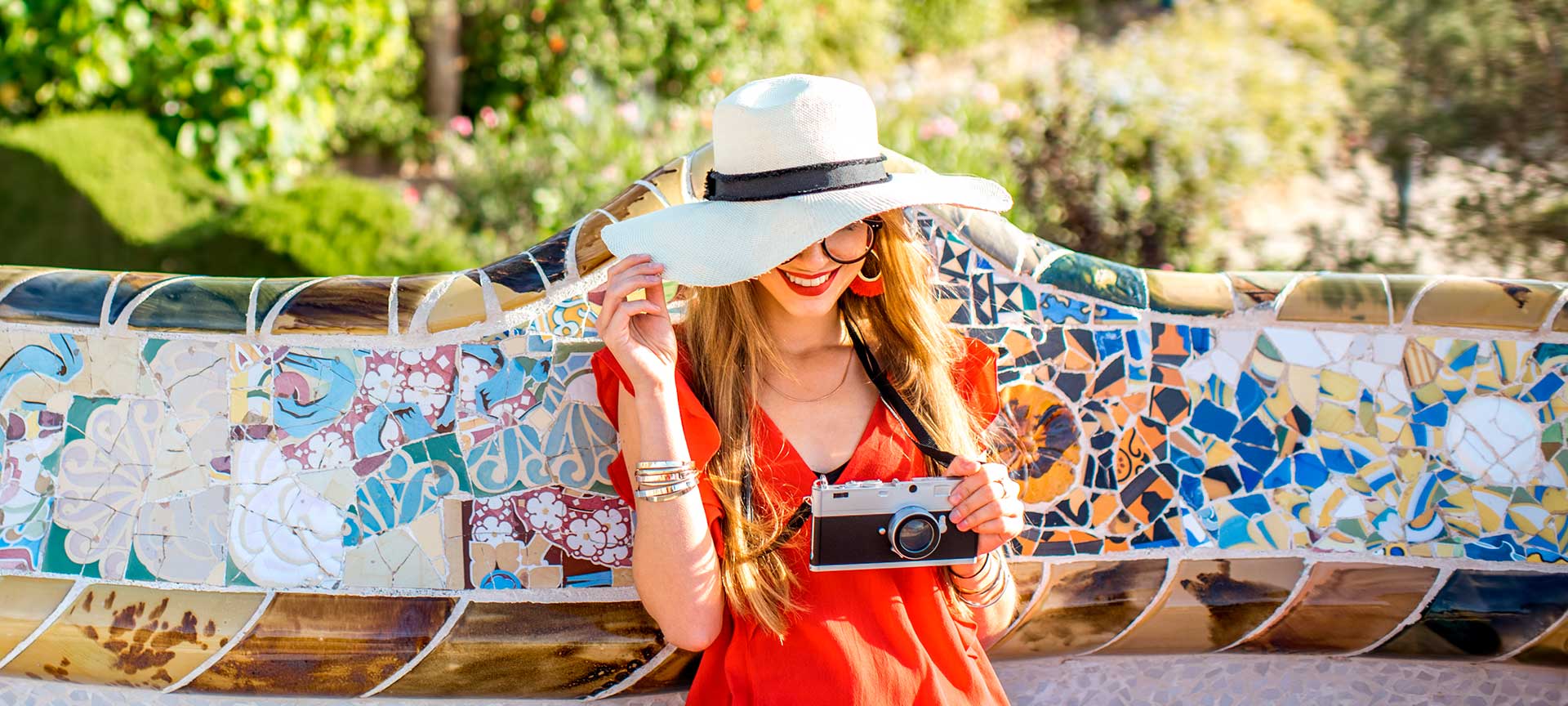 Experiences: day trips and tours Young woman in Park Güell, Barcelona