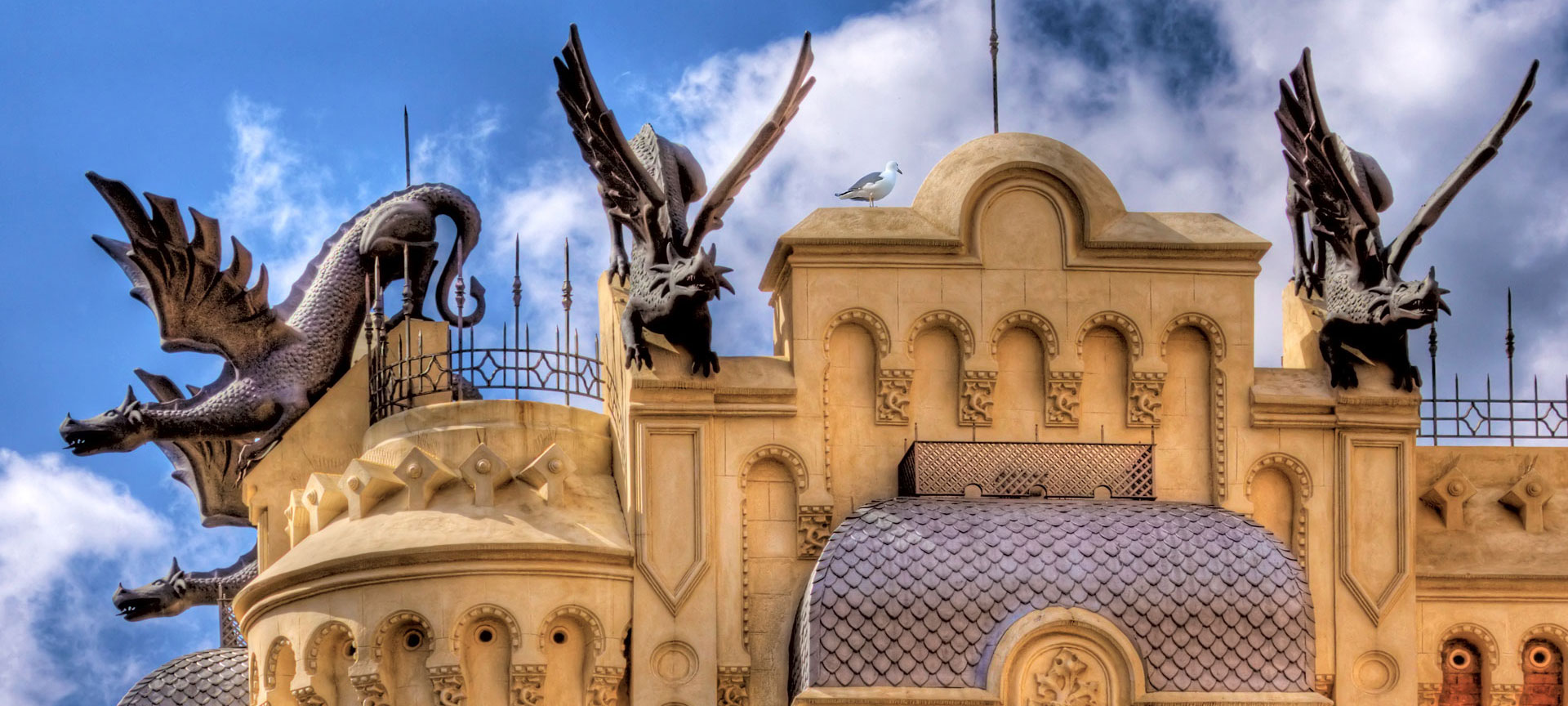 Detail of the roof of a house with dragon figures, in Ceuta