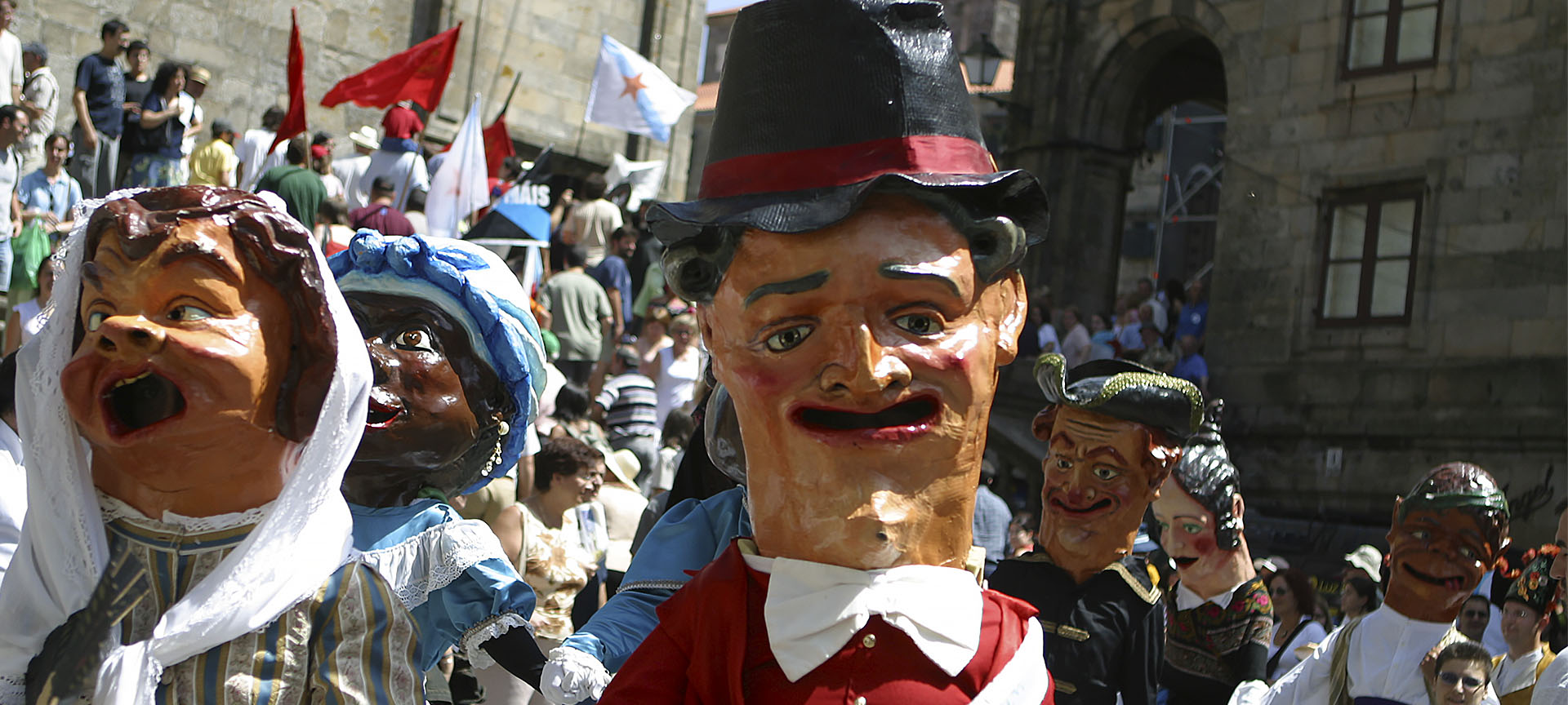 Parade of cabezudos during the Fiestas de la Ascensión Parade of cabezudos during the Fiestas de la Ascensión