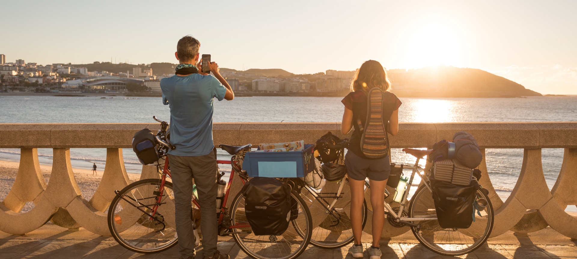 Tourists looking at the sea from the promenade of A Coruna, Galicia