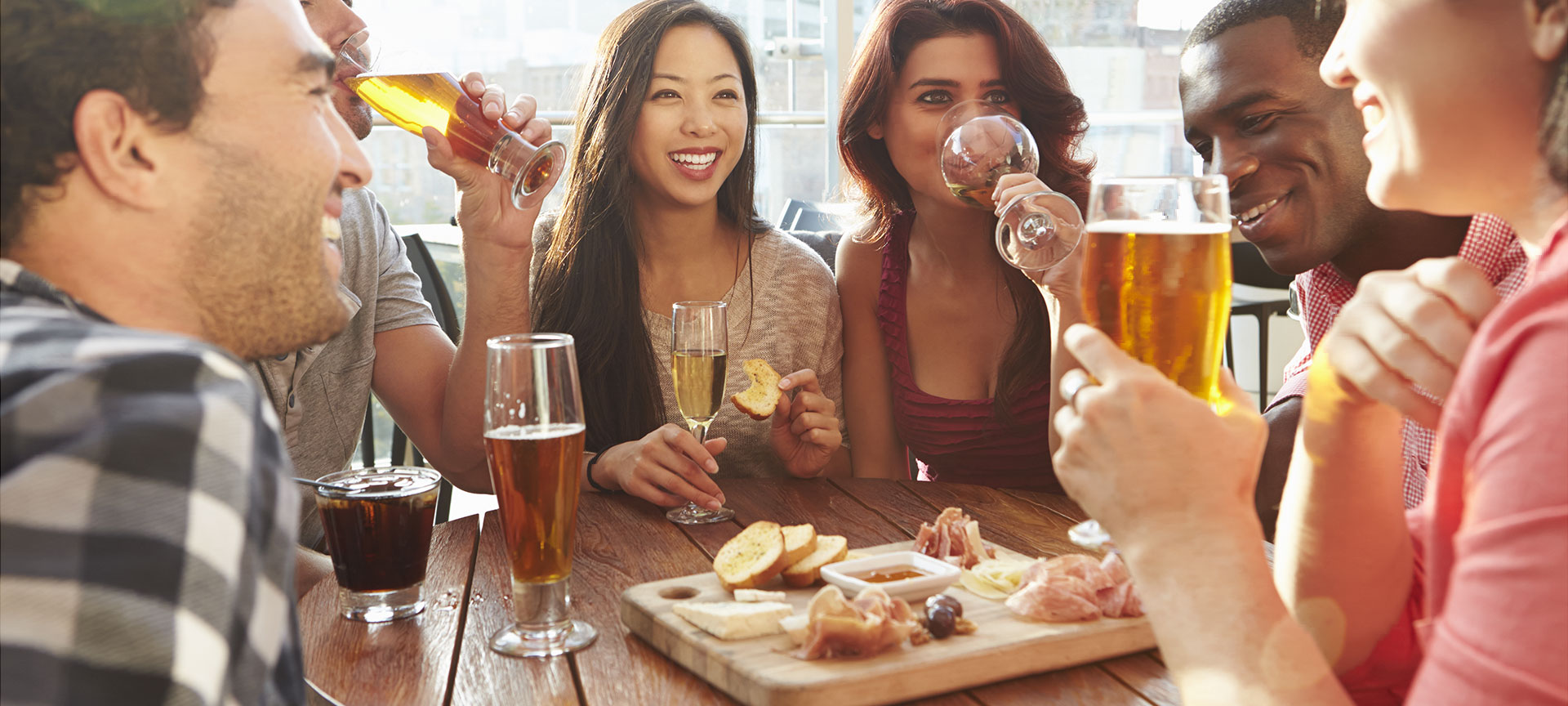 Friends enjoying tapas on a terrace