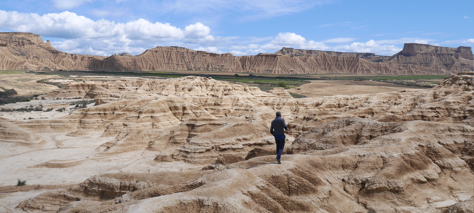 A man walking through the Bárdenas Reales Nature Reserve in Navarre