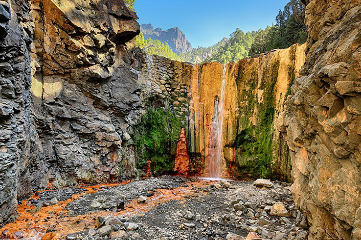Rainbow colours of the Cascada de Colores in the Caldera de Taburiente National Park on the Island of La Palma, Canary Islands Rainbow colours of the Cascada de Colores in the Caldera de Taburiente National Park on the Island of La Palma, Canary Islands