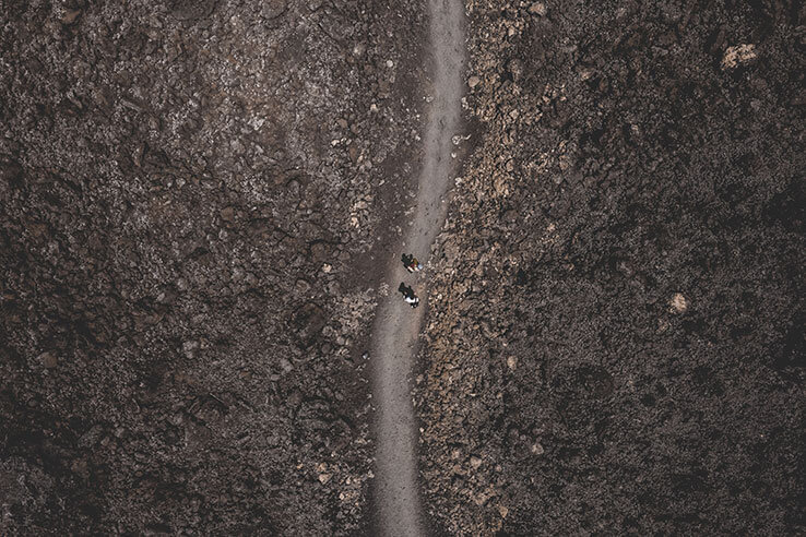 An aerial view of two hikers in the park An aerial view of two hikers in the park