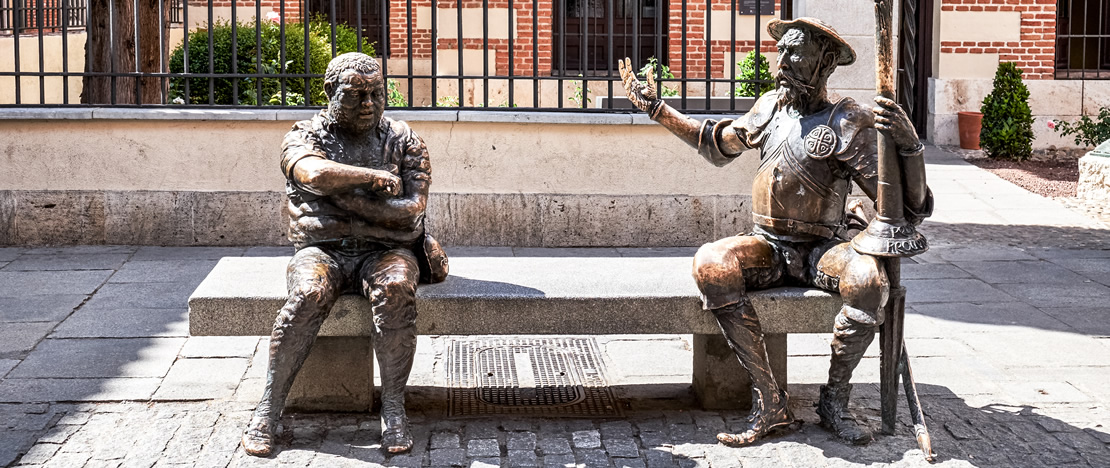 Figures of Sancho Panza and Don Quixote in front of the house where Miguel de Cervantes was born, in Alcalá de Henares, Region of Madrid