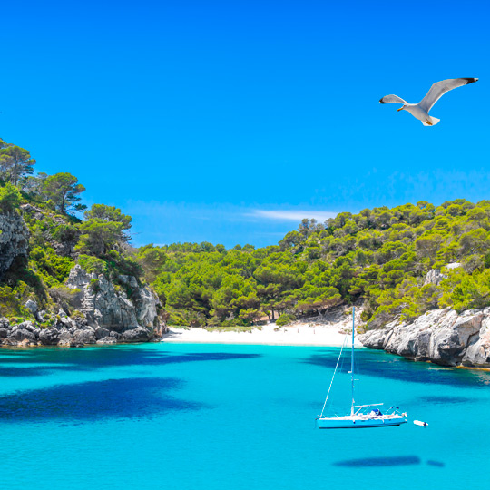The turquoise waters of Cala Macarella in Menorca