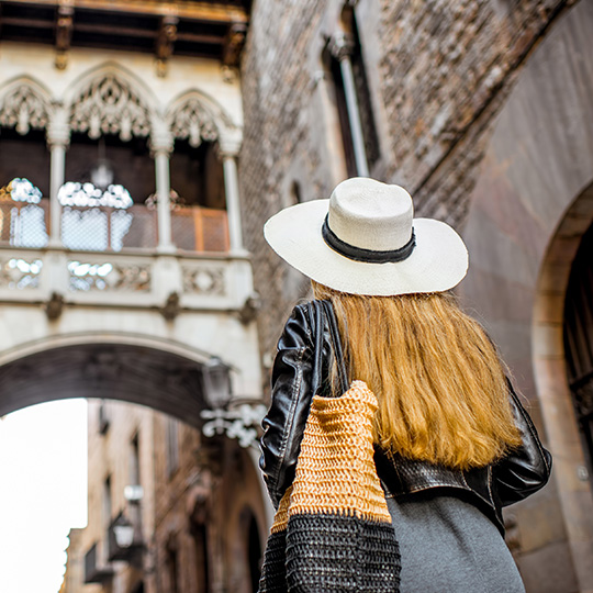 Young tourist enjoying the Gothic Quarter of Barcelona
