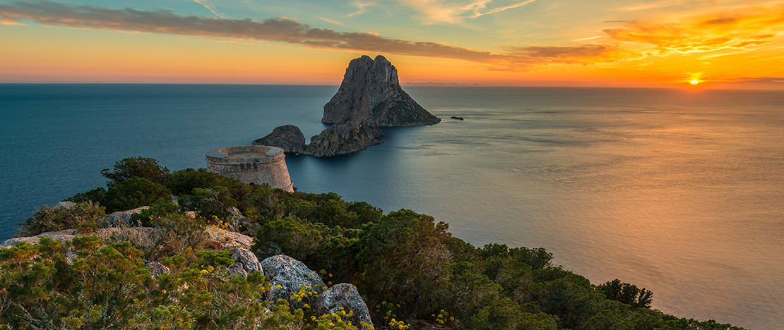 Sunset at Es Vedrà in Ibiza, Balearic Islands Sunset at Es Vedrà in Ibiza, Balearic Islands