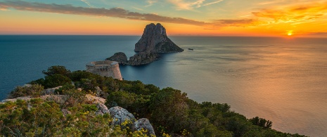 Sunset at Es Vedrà in Ibiza, Balearic Islands Sunset at Es Vedrà in Ibiza, Balearic Islands
