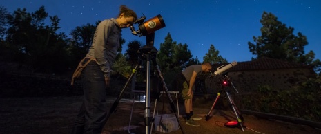 Tourists enjoying an astroexperience in La Palma, Canary Islands Tourists enjoying an astroexperience in La Palma, Canary Islands