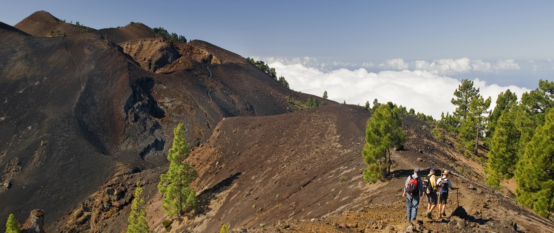 Hikers on the Route of the Volcanoes on La Palma, Canary Islands Hikers on the Route of the Volcanoes on La Palma, Canary Islands