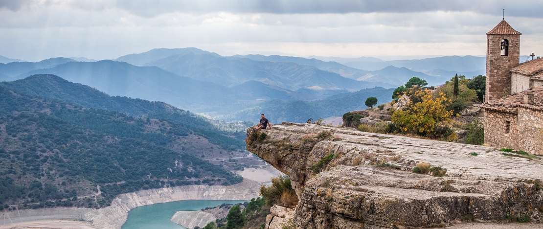 Tourist enjoying the views of Siurana in Tarragona, Catalonia Tourist enjoying the views of Siurana in Tarragona, Catalonia