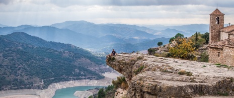 Tourist enjoying the views of Siurana in Tarragona, Catalonia Tourist enjoying the views of Siurana in Tarragona, Catalonia