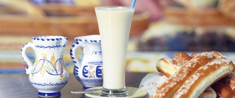 Glass of horchata and fartons Glass of horchata and fartons