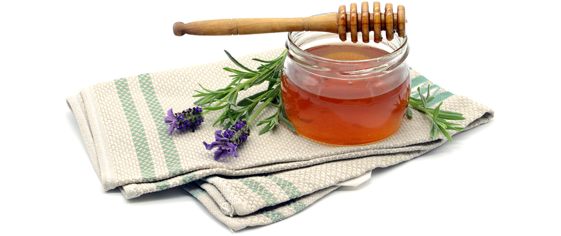 Honey jar with lavender flowers Honey jar with lavender flowers