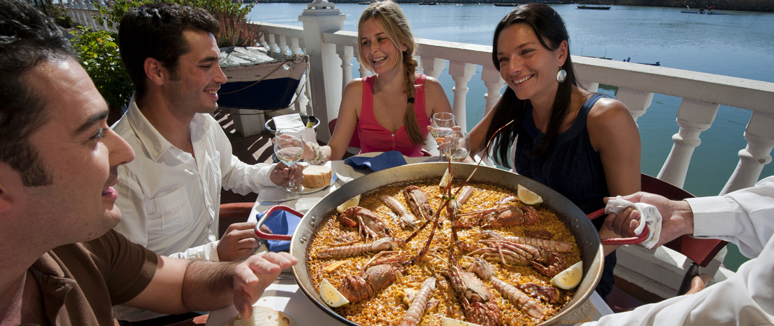 Friends eating paella Friends eating paella