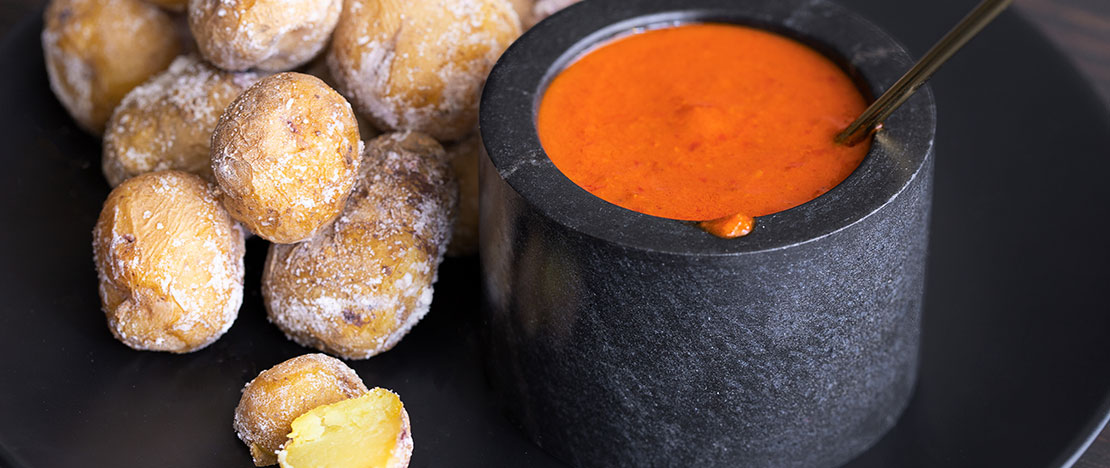 Papas arrugadas (wrinkly potatoes) with Mojo Picón (spicy sauce) Papas arrugadas (wrinkly potatoes) with Mojo Picón (spicy sauce)