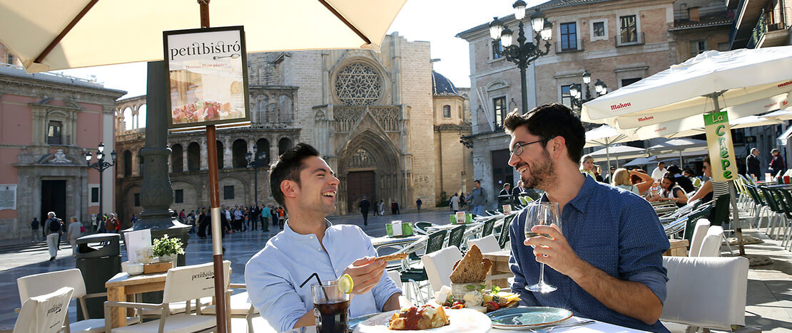 Friends on a street café in Valencia Friends on a street café in Valencia